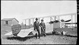 Two Spaniards [standing] by Spanish biplanes at Long Branch 10 July, 1915