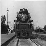 Canadian National Railway "Hudson" engine 5704 type steam locomotive at the station in Montreal West ca. 1930