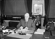 Col. Ralston at his desk 4 Jan. 1930