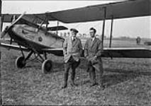 Captain Sparks and Engineer Collins of the U.S. Army Air Corps in front of DH-60 'Moth' aircraft taking part in the Montreal Air Pageant 6 Ot. 1929