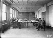 Room 24, Showing [personnel], film drying room being used for lecture purposes - RCAF Photo Room 24, Section, Jackson Building 7 Feb. 1929