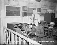 Two men at work in an office July 1950