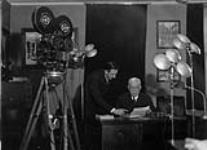 Roy Tash filming unidentified man n.d.