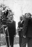 Roy Tash filming Lord Bessborough, Lord Lascelles (his secretary) and Prime Minister Bennett n.d.