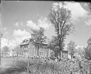 Beautiful stone house, tulips in foreground 20 June 1952