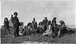 Chipewyan Indians and three white trappers camping at Cockles Point, [Manitoba] Aug. 18, 1929