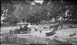 Team pulling an automobile out of Moon River, [Ont.] 17 Aug., 1917