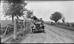 [Men] getting mail out of rural boxes, [near Lambton, Ont.], 9 June, 1917 9 June 1917