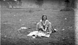 Gypsy woman washing clothes at a camp near Lambton [Mills], on the Humber River, [Toronto, Ontario.] Oct. 12, 1918