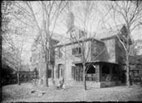 Mrs. Vincent Massey (Alice) with Lionel and Hart in front of their house 1922