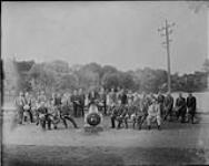 Men around cannon in park n.d.