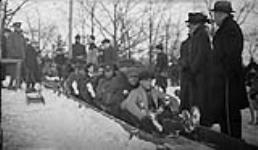 Toboggan on slides with soldiers and civilians, in High Park [Toronto, Ont.], 19 February, 1916 19 February 1916
