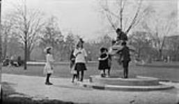 Children at a fountain in Allan Gardens 13 May, 1916