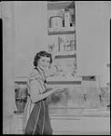 [A lady cleaning with] Swifts Cleanser 8 Feb., 1949