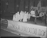 Children being confirmed at St. Coeur de Marie, [Quebec, P.Q.], 25 April, 1949 25 Apr. 1949