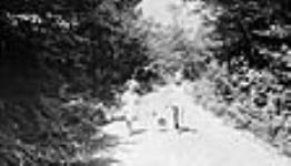 Parker children on road after fishing, Bala, [Ont.], 10 July, 1920 10 July 1920