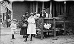 Immigrants on Kensington Avenue, Toronto, Ontario. June 1, 1922 June 1, 1922