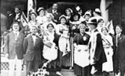 Group photograph taken on the occasion of the dinner given for Italian-Canadian Reservists by the women of the Italian Red Cross Society, Toronto, Ontario c 1915.