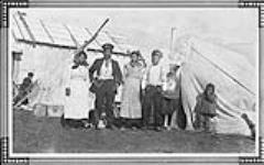 [Inuit family, Aklavik, Northwest Territories] Original title: Eskimo family, Aklavik, N.W.T Aug., 1925