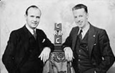 Jack Dale at microphone with unidentified gentleman n.d.