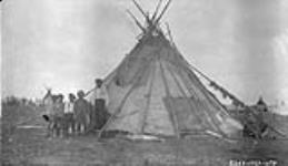 [Cree children next to a teepee] Original Title: Indian Camp July 1927.