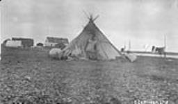 [Teepee with canoes] Original Title: Indian camp July 1927.