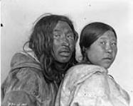 Kidlak (sky) and wife Ne-ve-et-cher (young girl), Igloali, Melville Peninsula, [N.W.T.] May 1926.