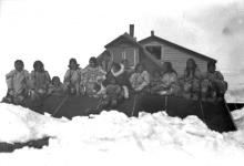 [Group of Inuit sitting on the roof of Hudson's Bay Company buildings] Original title: Natives on roof, H.B. Company buildings 1926