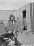 [Perry River Inuit with a dog] Original title: Perry River natives 25 September 1928.