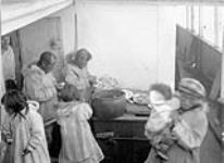 [Inuit having a meal on board S.S. Baychimo] Original title: Native meal on board "Baychimo" August 1930.
