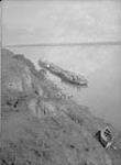 Liard River with barges and a canoe in the foreground July 1930.