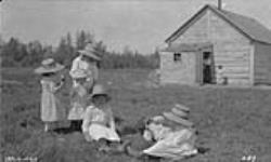 Group of children at Fort Simpson, Mary Belle and Charles Camsell 1921