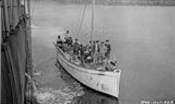 H.B. Co. Schooner standing by as the "Beothic" hauls up the anchor at Lake Harbour 1929