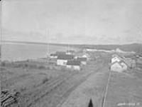 The water front at [Fort] Good Hope with the Royal Canadian Mounted Police (R.C.M.P.) and Traders September 1928.