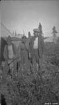 [Chief Jimmy Soldat of the Sahtu Got'ine First Nation with his wife and an unidentified man] Original title: The Chief of Bear Lake Indians (Jimmy Soldat) and his wife September 1928.