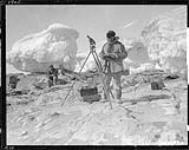 Soper taking observations at low tide south coast of Foxe Basin 1929
