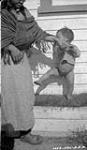 [Medical Officer's Inuk domestic servant and her child] Original title: Medical Officer's native domestic servant and her child 21 August 1935.