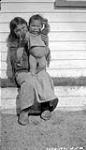[Medical Officer's Inuk domestic servant with her child] Original title: Medical Officer's native domestic servant with her child 21 August 1935.