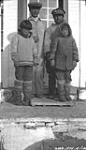 [Inuit men and children at Dundas Harbour] Original title: Natives at Dundas Harbour 11 September 1935.