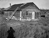 [Cabin at Gwich'in village at mouth of the Peel River] Original title: Indian cabin at Indian village at mouth of Peel River 1945