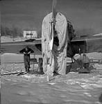 [Working on a Junkers W-34 aircraft] n.d.