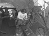 Sewing soles on sealskin shoes 1925