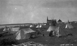 [Dene teepees and wall tents at Fort Resolution] Original title: Indian encampment at [Fort] Resolution 1924