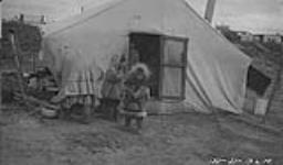 [Indigenous (possibly Inuit or Gwich'in) family and tent] Original title: Eskimo tent and family 1921