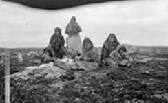Inuit group from Schultz Lake resting while on route to hunt caribou at Thelon Game Sanctuary 1930