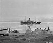 "Beothic" lying off Pond Inlet Detachment showing the hills of Bylot Island in the distance across Eclipse Sound 1926