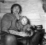 Igloolik, N.W.T. Inside an igloo [The late Clara Tutiktuq Quassa and her daughter Veroni (Véronique)] 1950.