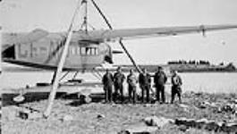 [Leigh Brintnell third from the right with a Fairchild Super 71 aircraft] [between 1930-1939].