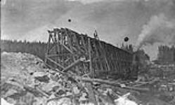 Trestle under construction on [National] Transcontinental Railway, 1 1/2 miles West of Good Lake, North-Western Ontario Spring 1909 1909