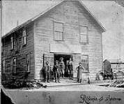 Mac Garrow's building. Gid Lane's blacksmith shop was at the front of the building, and Mac Garrow's wheelwright and carriage shop was at the rear 1890 - 1900